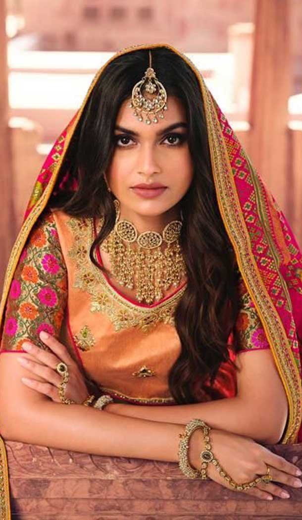 Attractive Peach Color Silk Designer Heavy Bridal Wear Lehenga Choli -1646131751