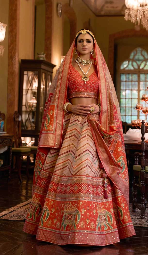 Wedding Wear Orange Color Rajwadi Silk Sparkle Mirror Work Designer Lehenga Choli - 7108174327