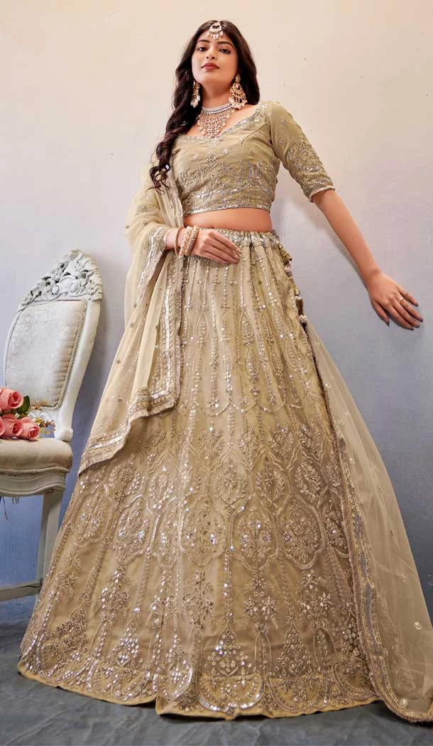 Sequins Work In Butterfly Net Dark Cream Color Mehendi and Sangeet Ceremony Lehenga Choli - 8090180276