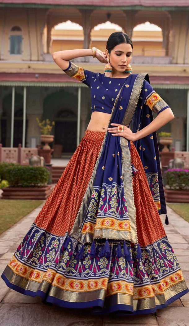Tussar Silk Patola Work Stunning Navratri Lehenga Choli in Orange -9221186301