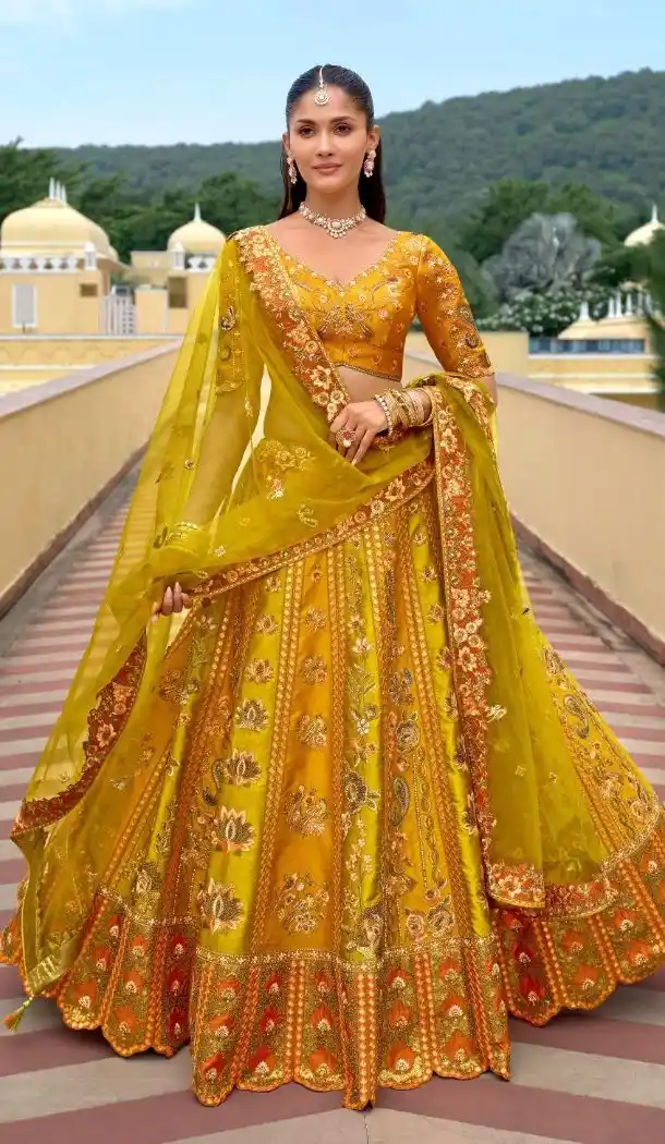 Women Silk Stone Embroidery Work Yellow Wedding Lehenga - 13660213924