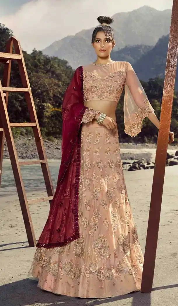 Ravishing Peach Color Net Heavy Embroidered Designer Lehenga Choli -1579131252